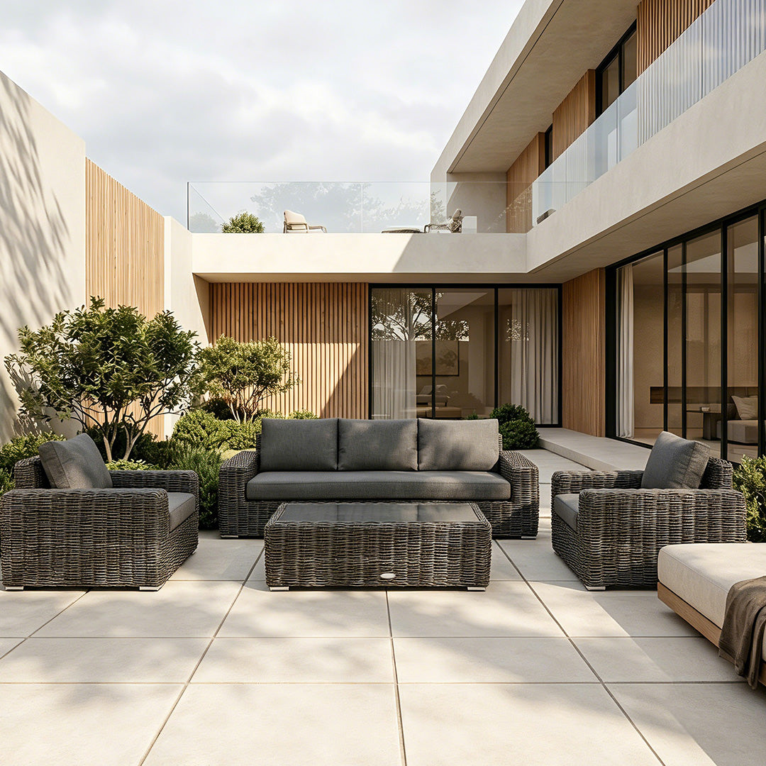 Owen dark grey wicker outdoor sofa set on a patio