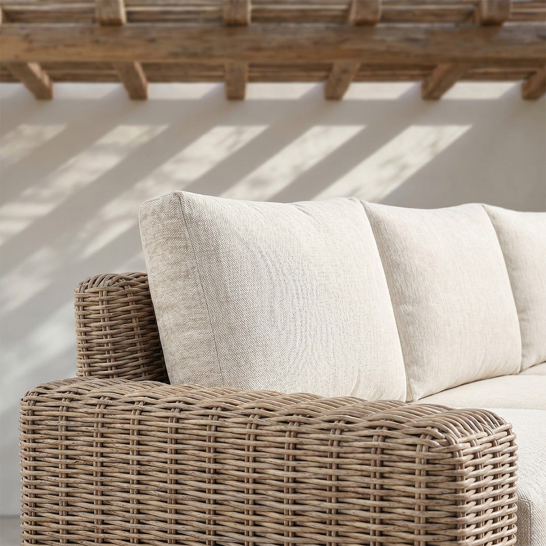 Owen outdoor sofa wicker armrest and beige cushion close-up