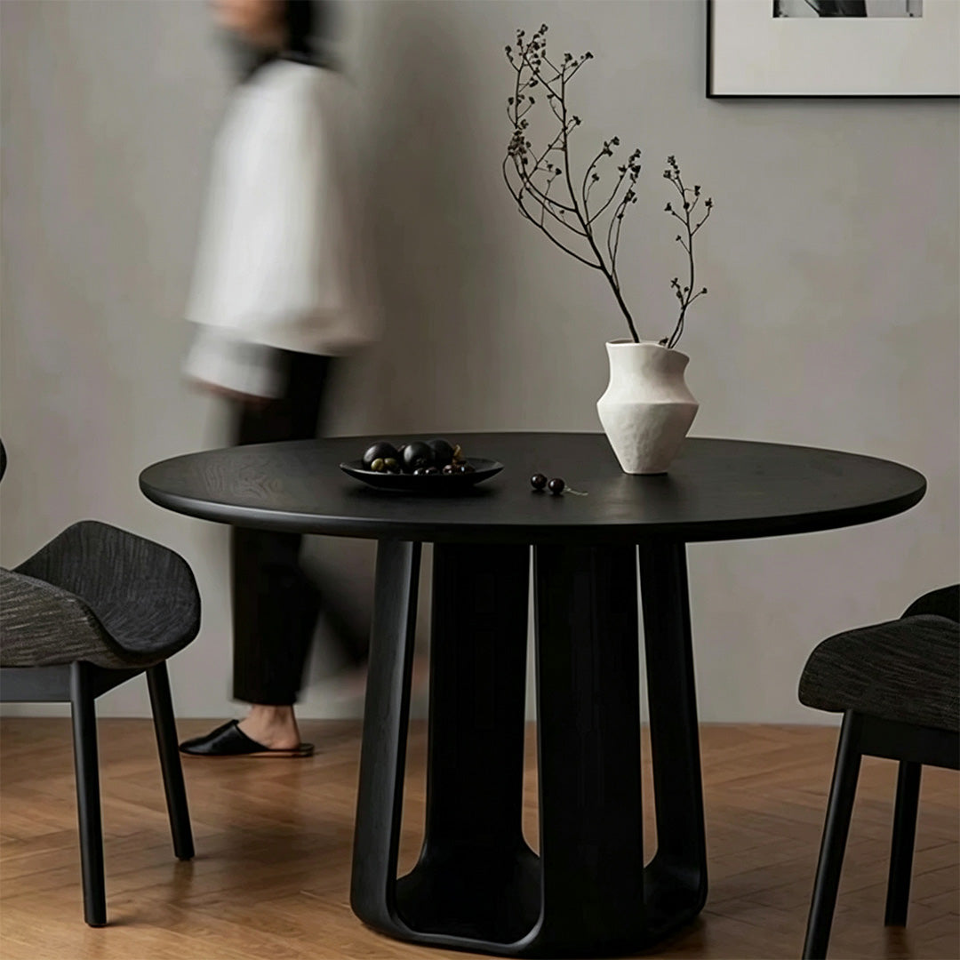 Landon round dining table with sculptural black pedestal base